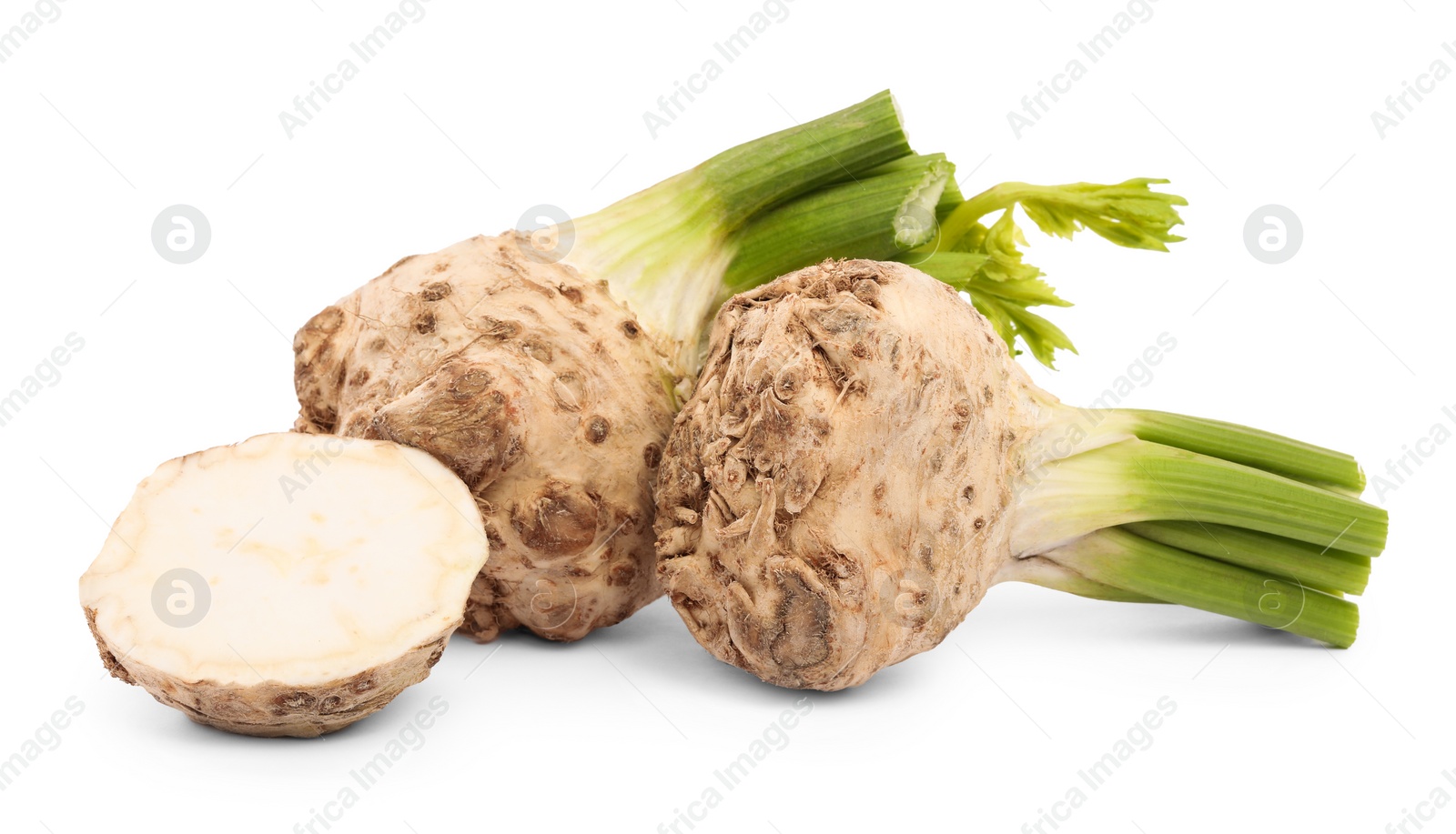 Photo of Whole and cut celery roots isolated on white