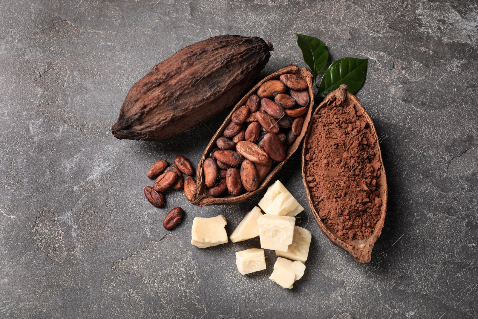 Photo of Flat lay composition with organic cocoa butter on grey table