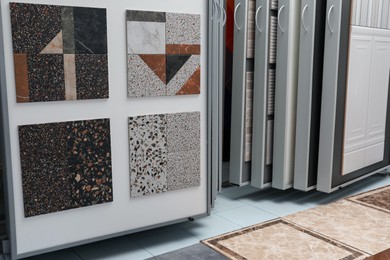 Photo of Samples of tiles with different patterns on display in store