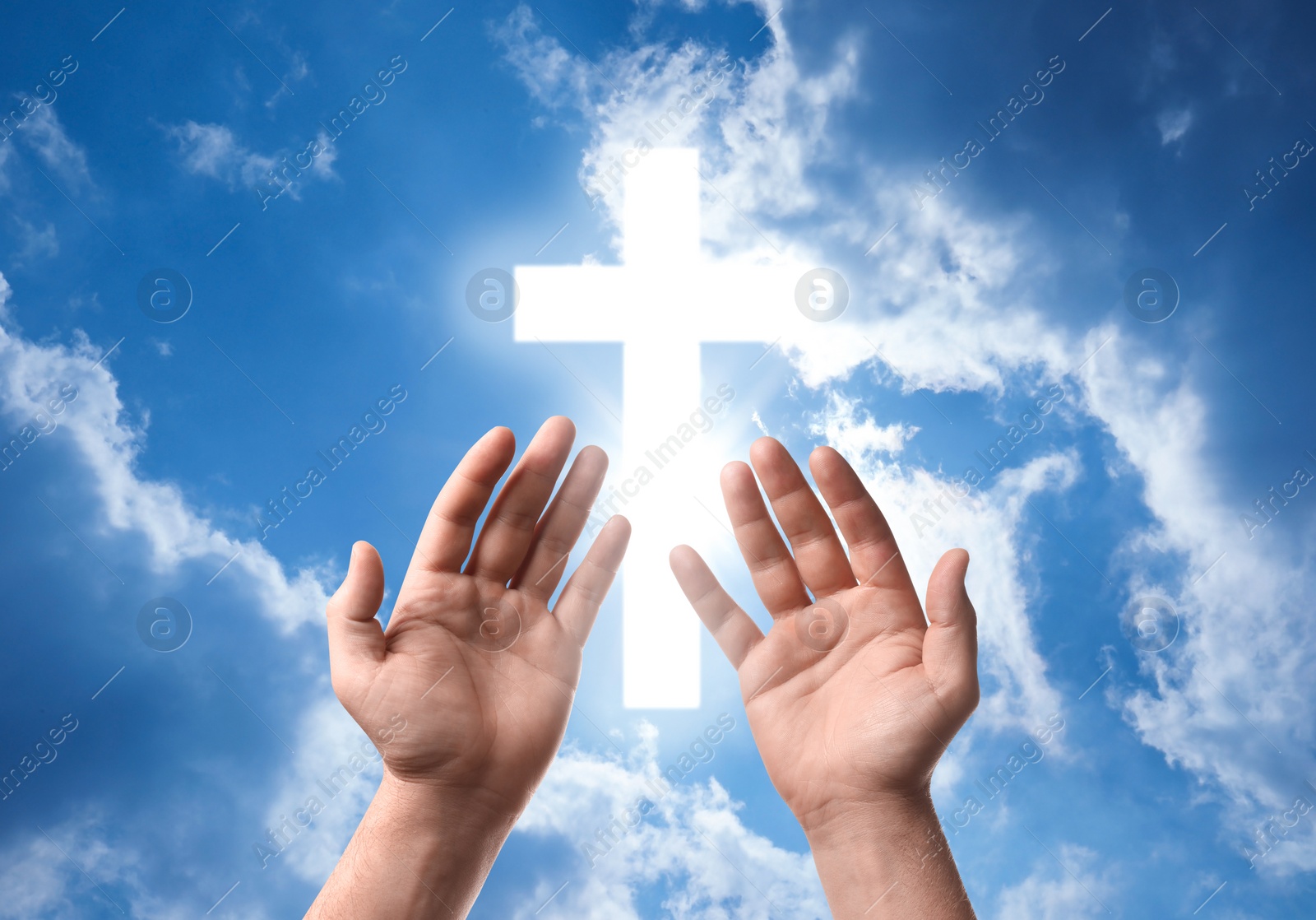 Image of Religion. Christian man praying against sky with glowing cross, closeup