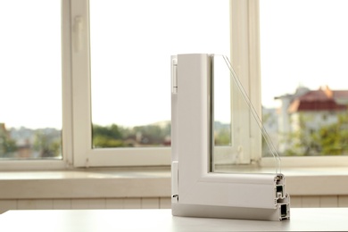 Photo of Sample of modern window profile on table indoors