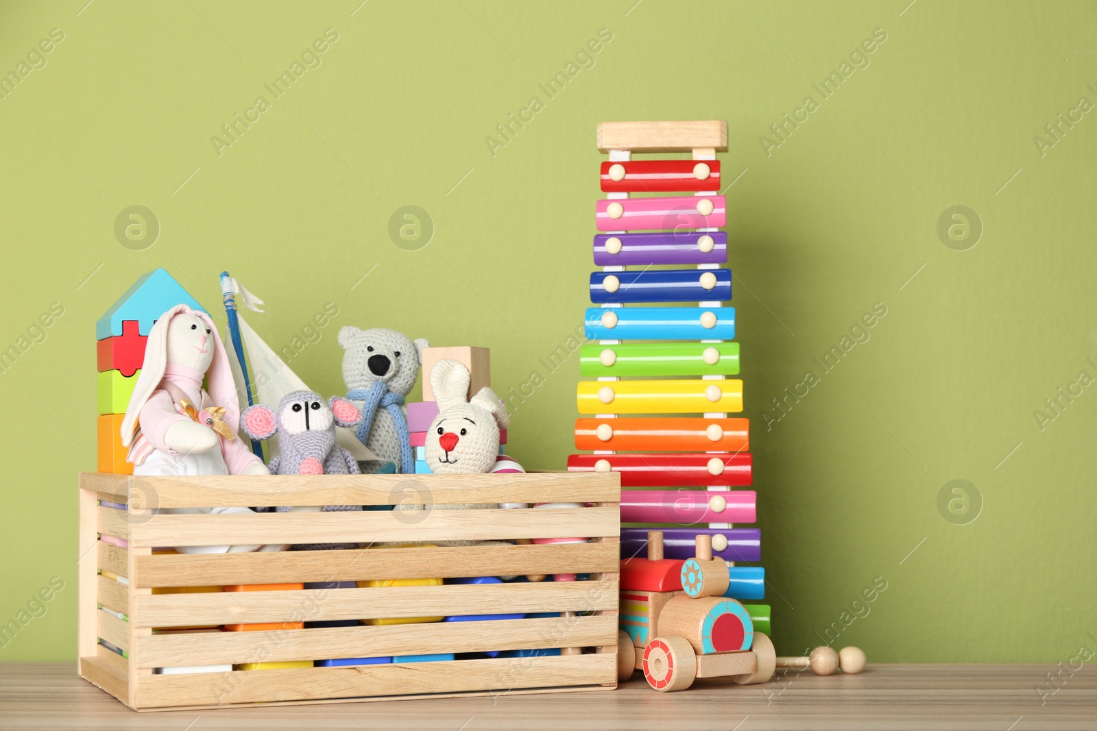 Photo of Set of different toys on wooden table