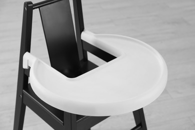Photo of Stylish baby high chair indoors, closeup view