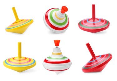Different spinning tops isolated on white. Toy whirligig
