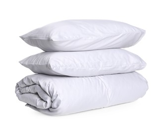Photo of Stylish silky bed linens and pillows on white background