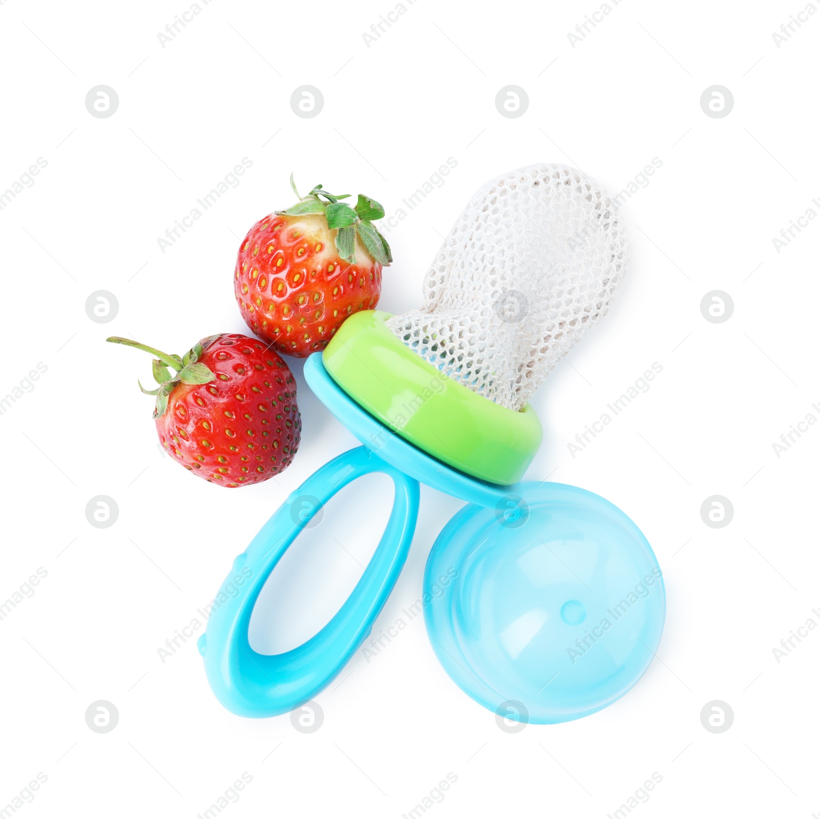 Photo of Empty nibbler and strawberries on white background, top view. Baby feeder