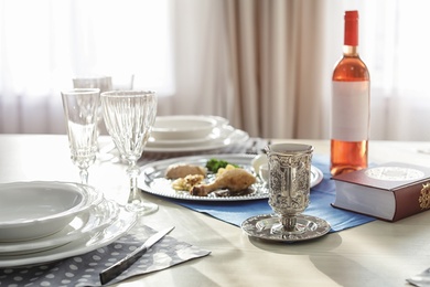 Photo of Table served for Passover (Pesach) Seder indoors