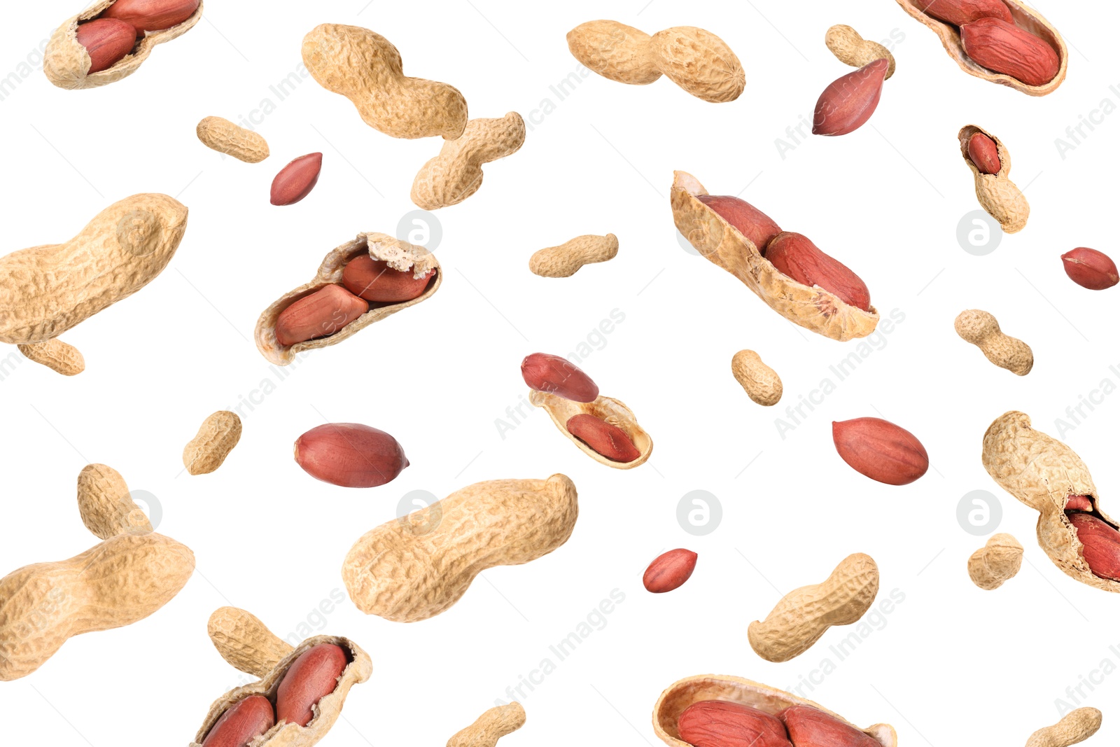 Image of Unpeeled peanuts in air on white background