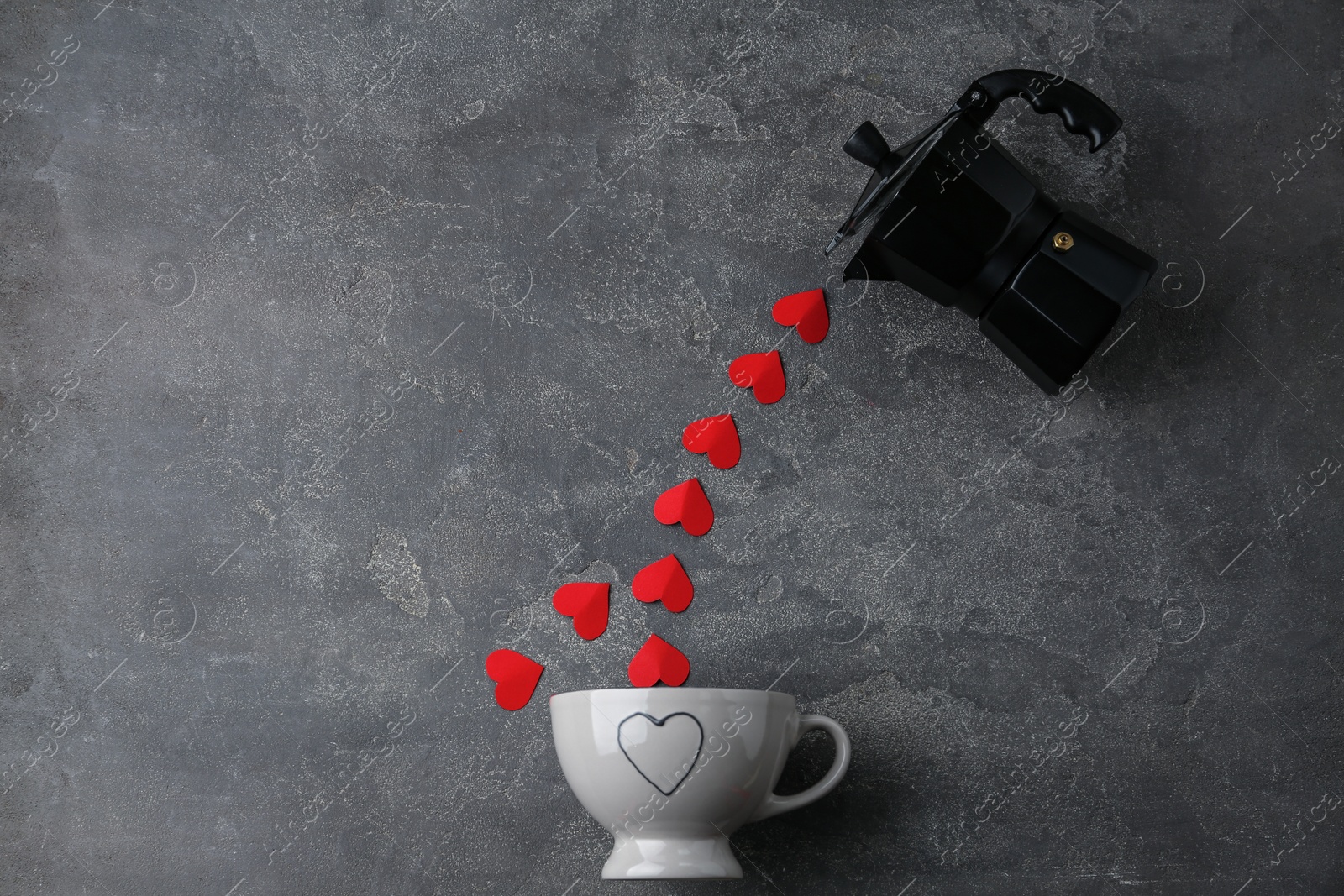 Photo of Flat lay composition with moka pot, cup and red paper hearts on grey background