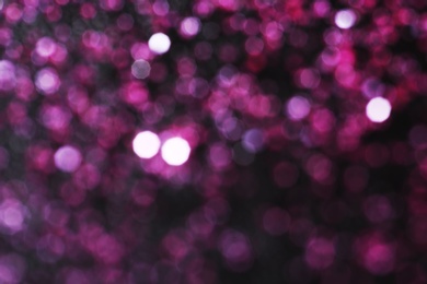 Photo of Magic pink bokeh effect on dark background