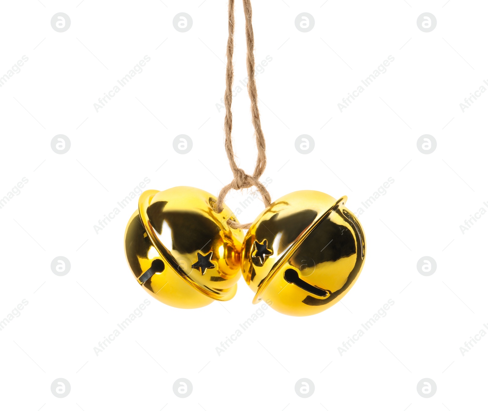 Photo of Shiny golden sleigh bells on white background