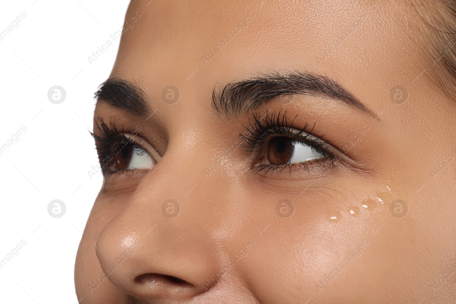 Photo of Woman with eye cream on white background, closeup. Skin care