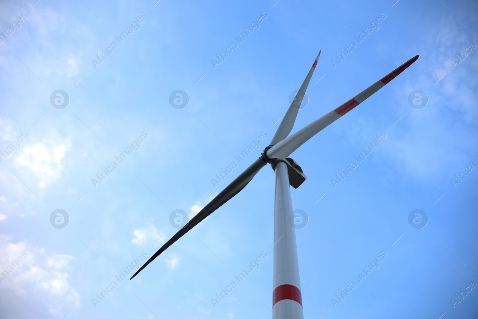 Photo of Wind turbine against beautiful blue sky, low angle view. Alternative energy source