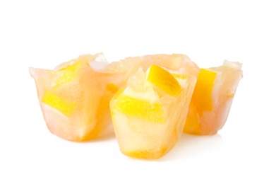 Ice cubes with orange slices on white background