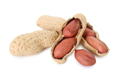 Photo of Fresh peanuts isolated on white. Healthy snack