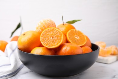 Photo of Fresh juicy tangerines on white marble table