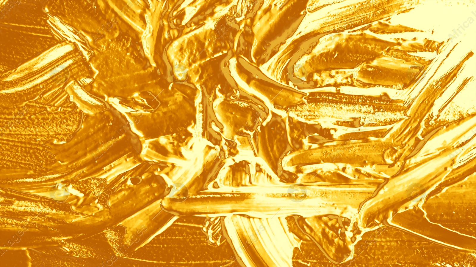 Image of Strokes of golden paint as background, closeup