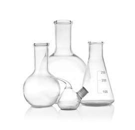 Photo of Set of empty laboratory glassware on white background