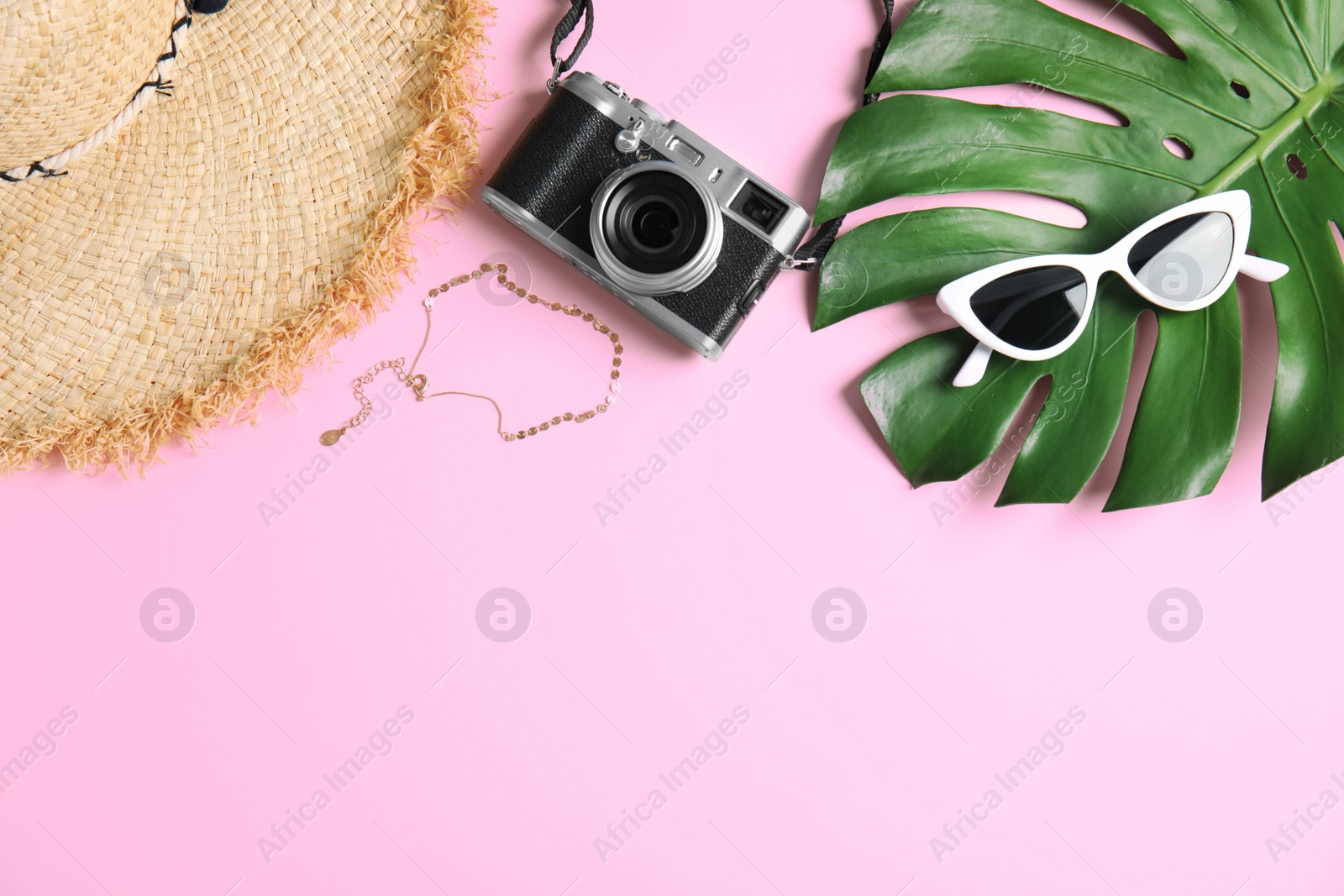 Photo of Flat lay composition with camera and female accessories on color background, space for text. Travel blogger