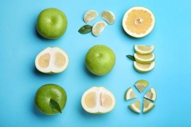 Fresh ripe sweeties on light blue background, flat lay