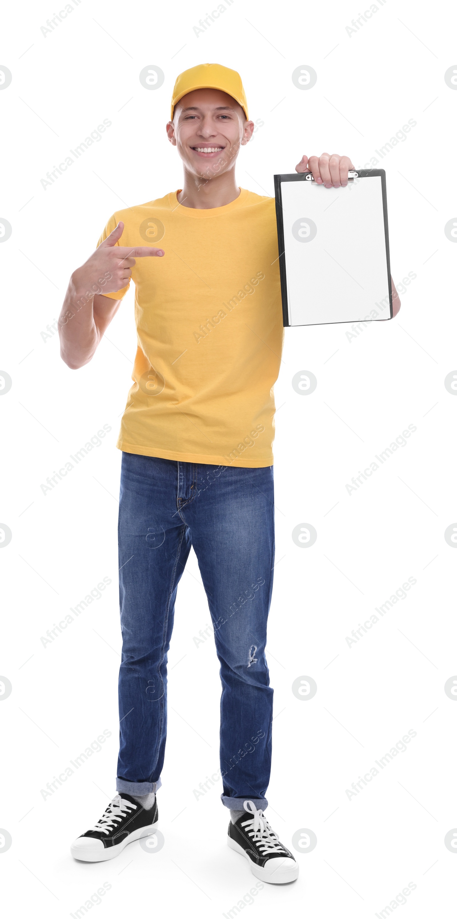 Photo of Happy courier pointing at clipboard on white background