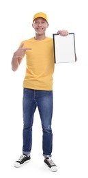 Happy courier pointing at clipboard on white background