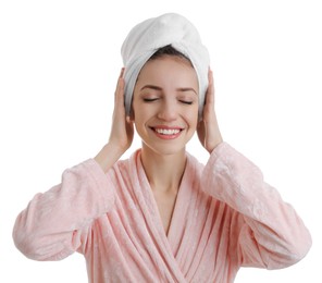 Photo of Beautiful young woman with hair wrapped in towel after washing on white background