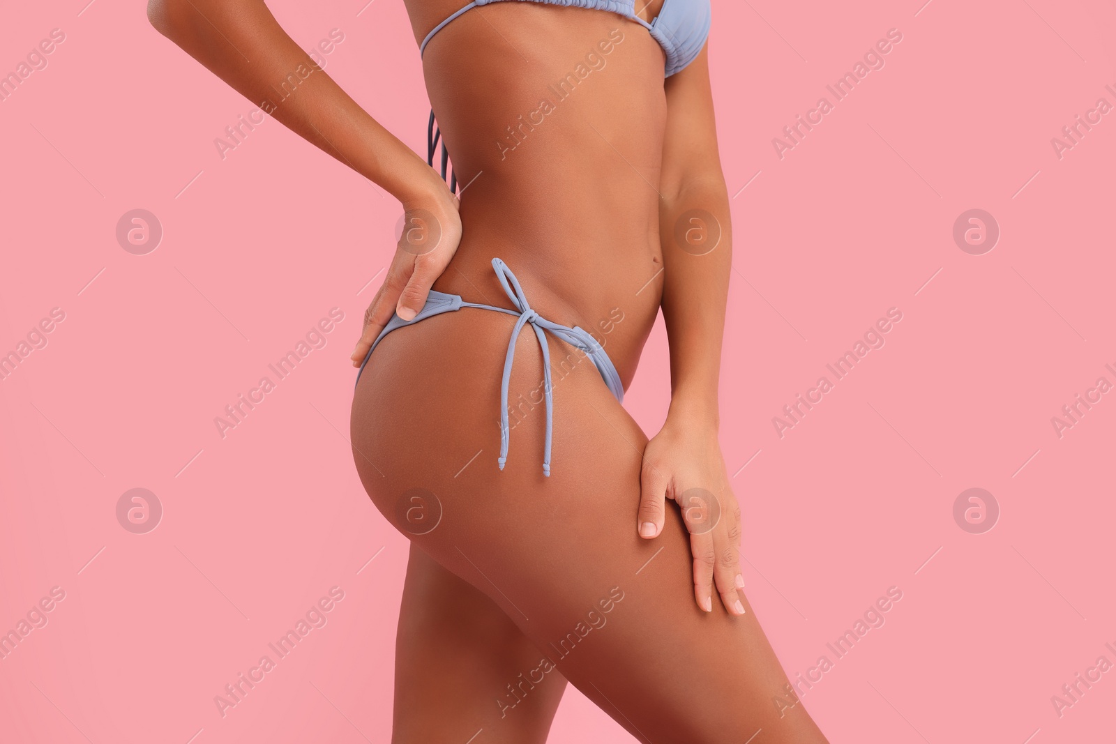 Photo of Woman in stylish bikini on pink background, closeup