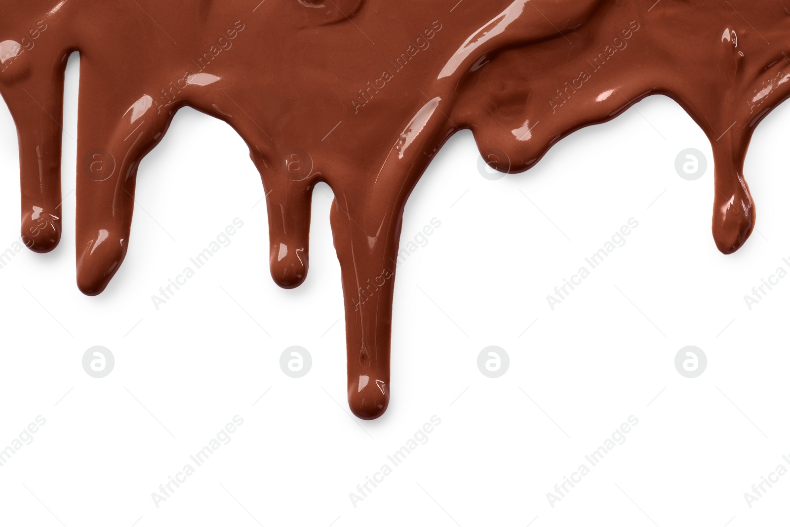 Photo of Tasty melted milk chocolate pouring down on white background