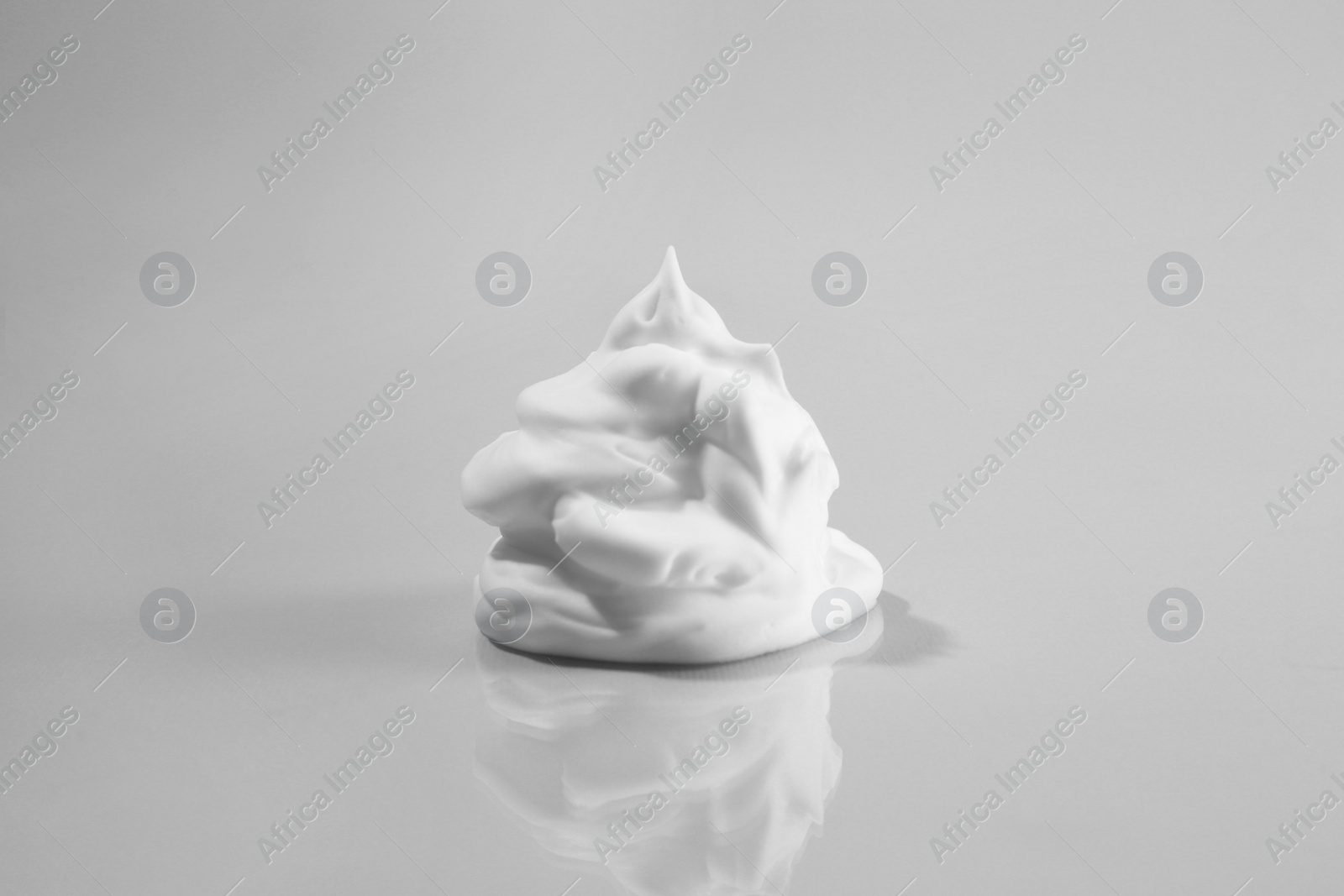 Photo of Sample of cleansing foam on light background. Cosmetic product