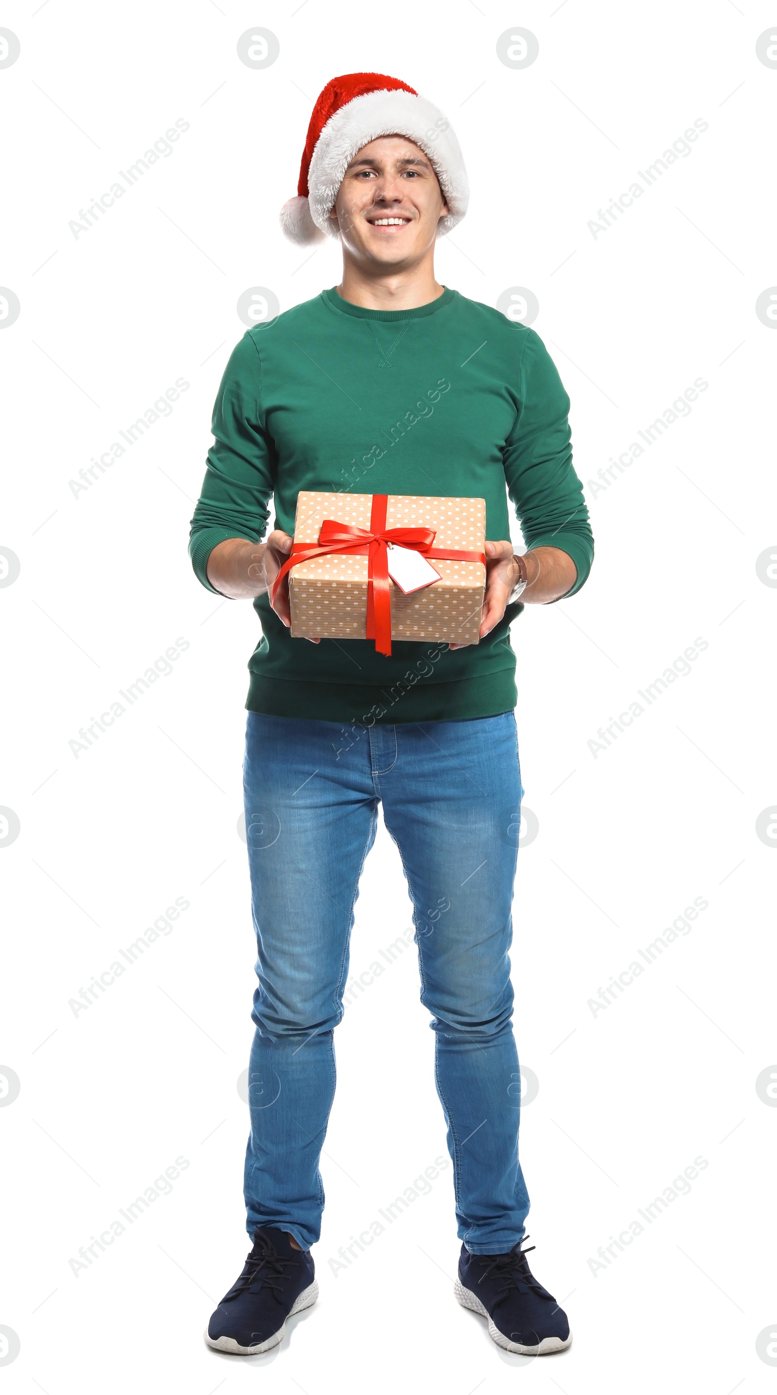 Photo of Young man with Christmas gift on white background