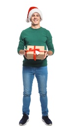 Photo of Young man with Christmas gift on white background