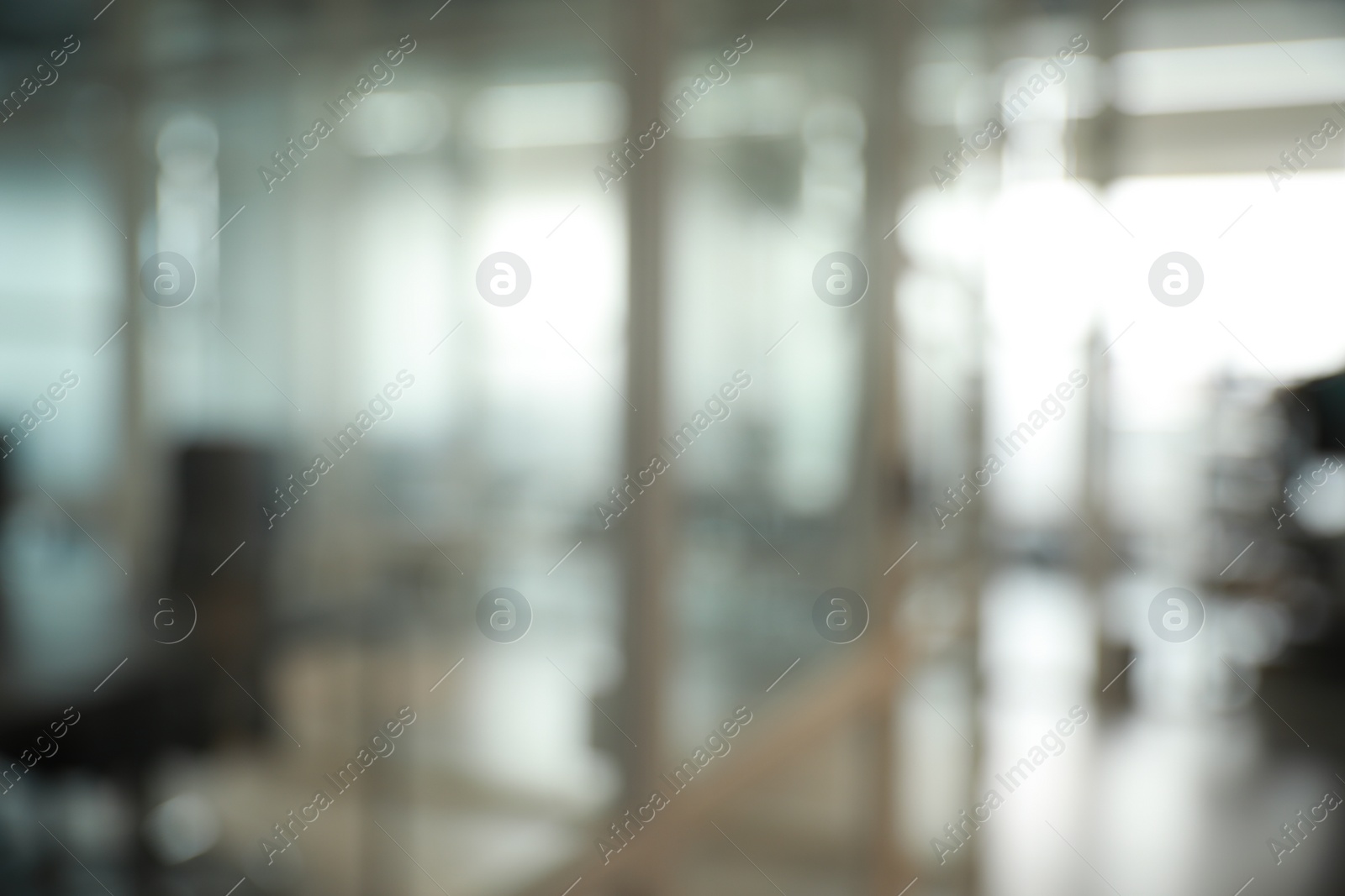 Photo of Blurred view of cozy workspaces with tables and chairs in office