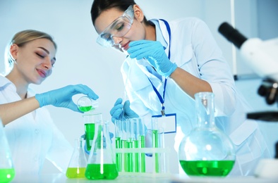 Photo of Female scientists working with sample in chemistry laboratory
