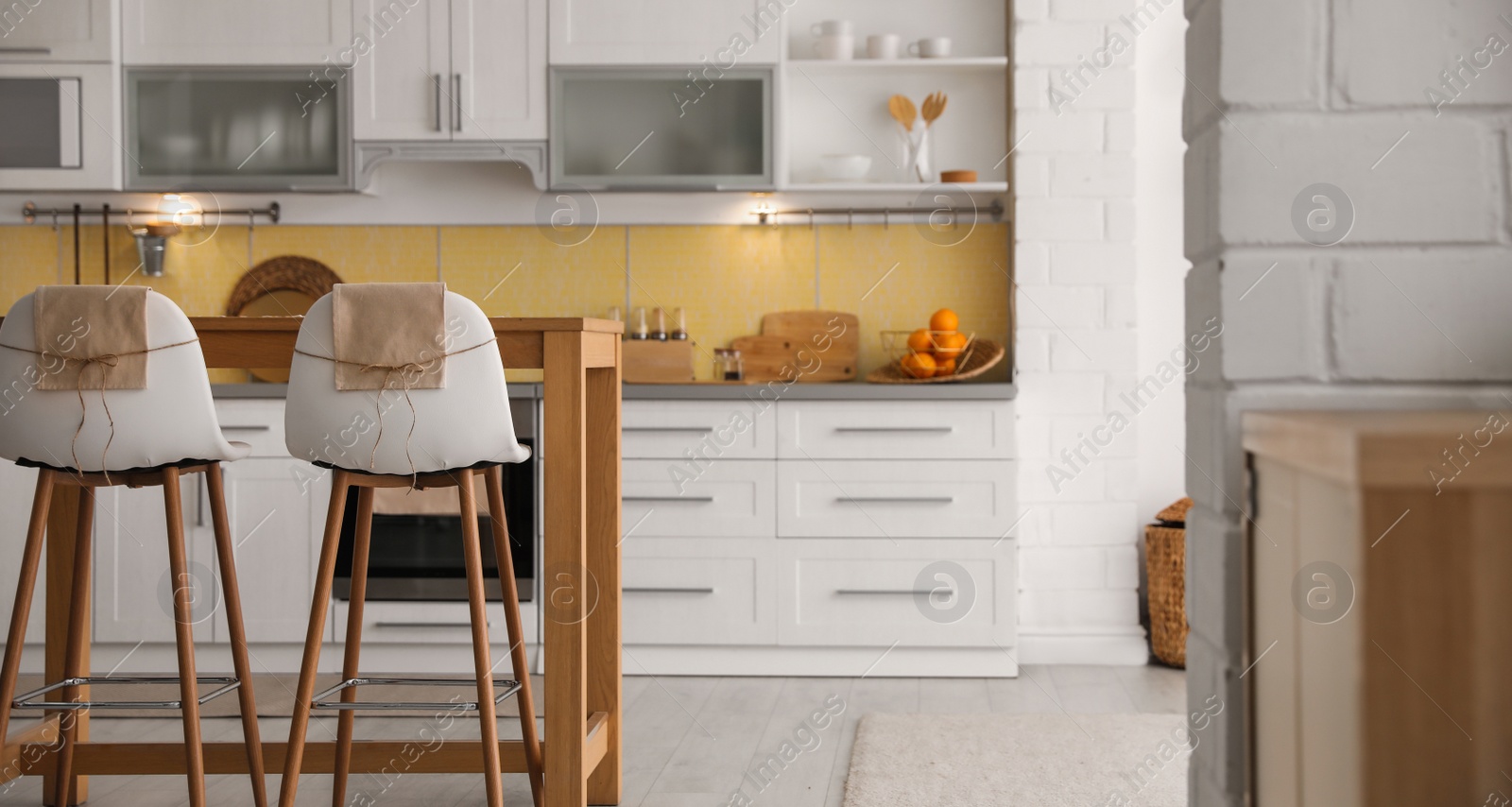 Image of Modern kitchen interior with stylish wooden table. Banner design