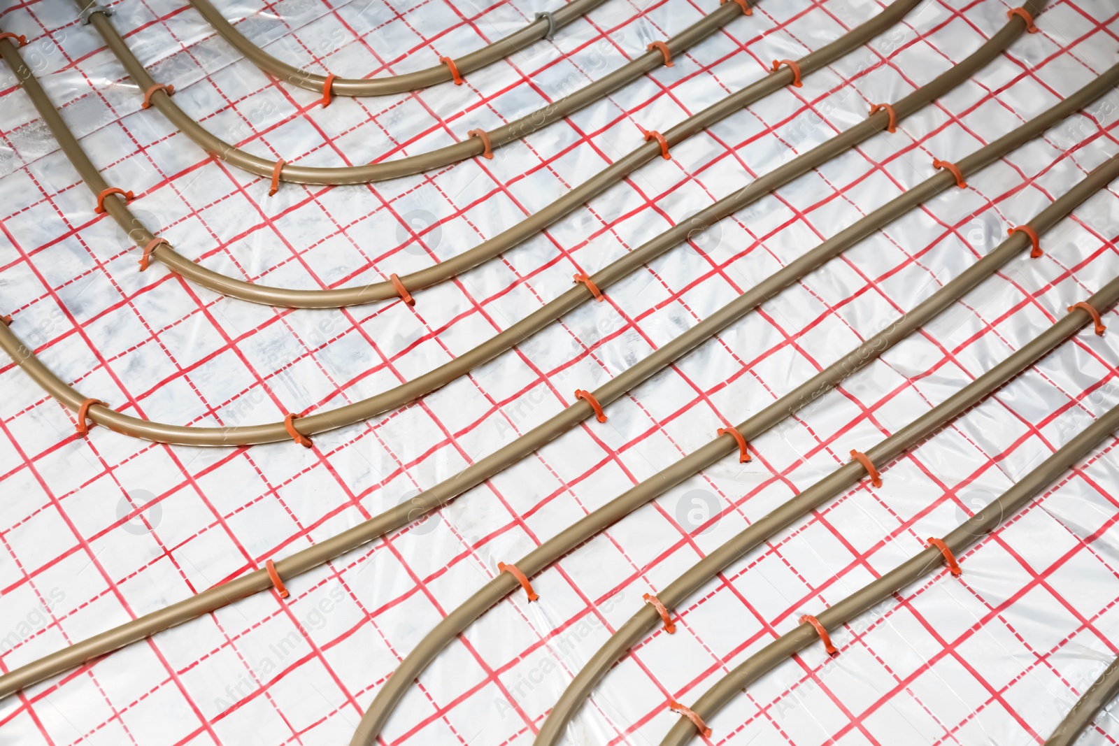 Photo of Installation of underfloor heating system in building