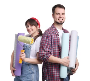Photo of Couple with wallpaper rolls and roller on white background