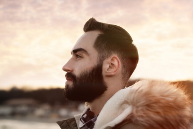 Portrait of stylish handsome young man outdoors