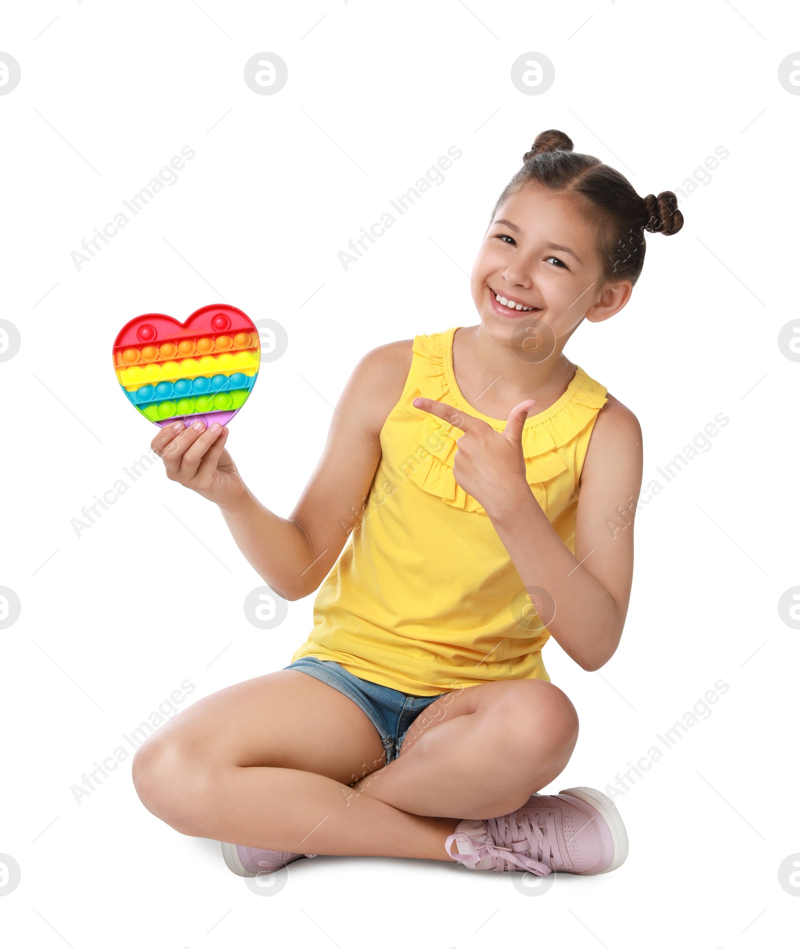 Photo of Girl with pop it fidget toy on white background