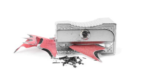 Metal sharpener with pencil shavings on white background