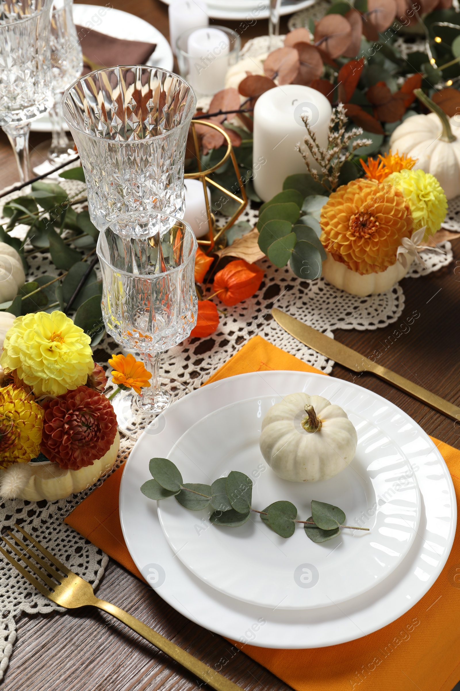 Photo of Beautiful autumn table setting. Plates, cutlery, glasses and floral decor