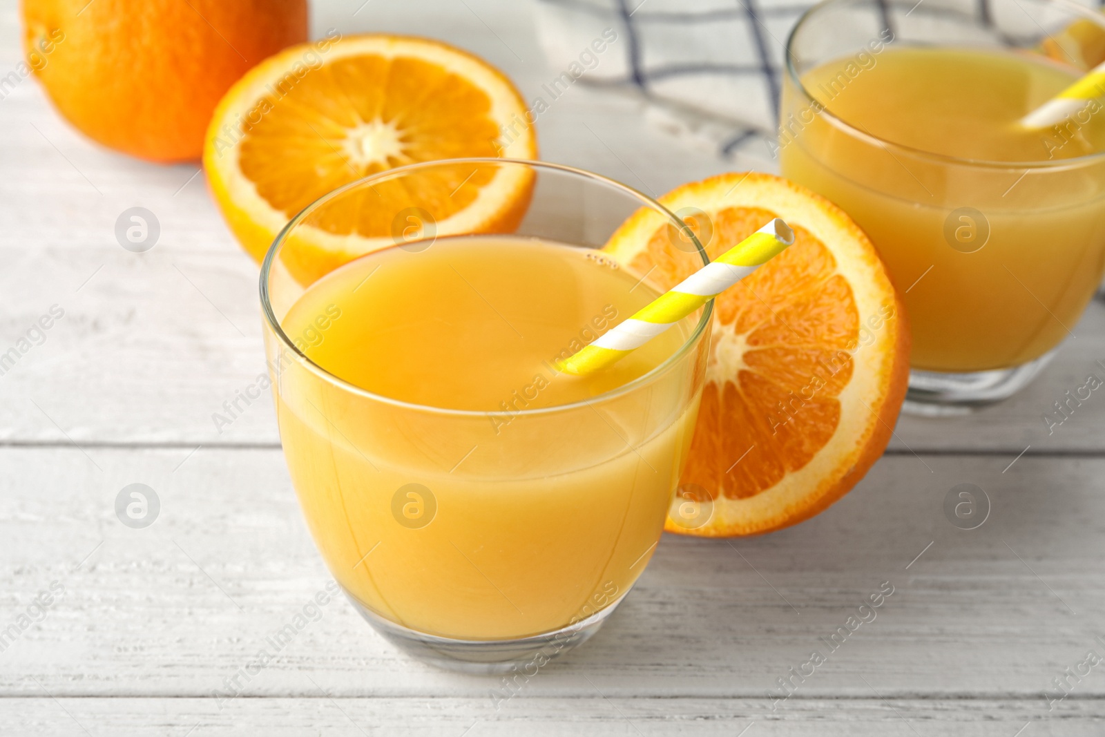 Photo of Composition with orange juice and fresh fruit on wooden background