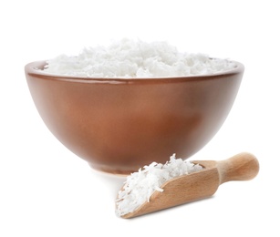 Photo of Fresh coconut flakes in bowl on white background