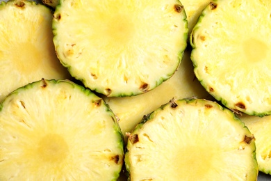 Fresh sliced pineapple as background