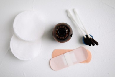 Flat lay composition with bottle of medical iodine on white table