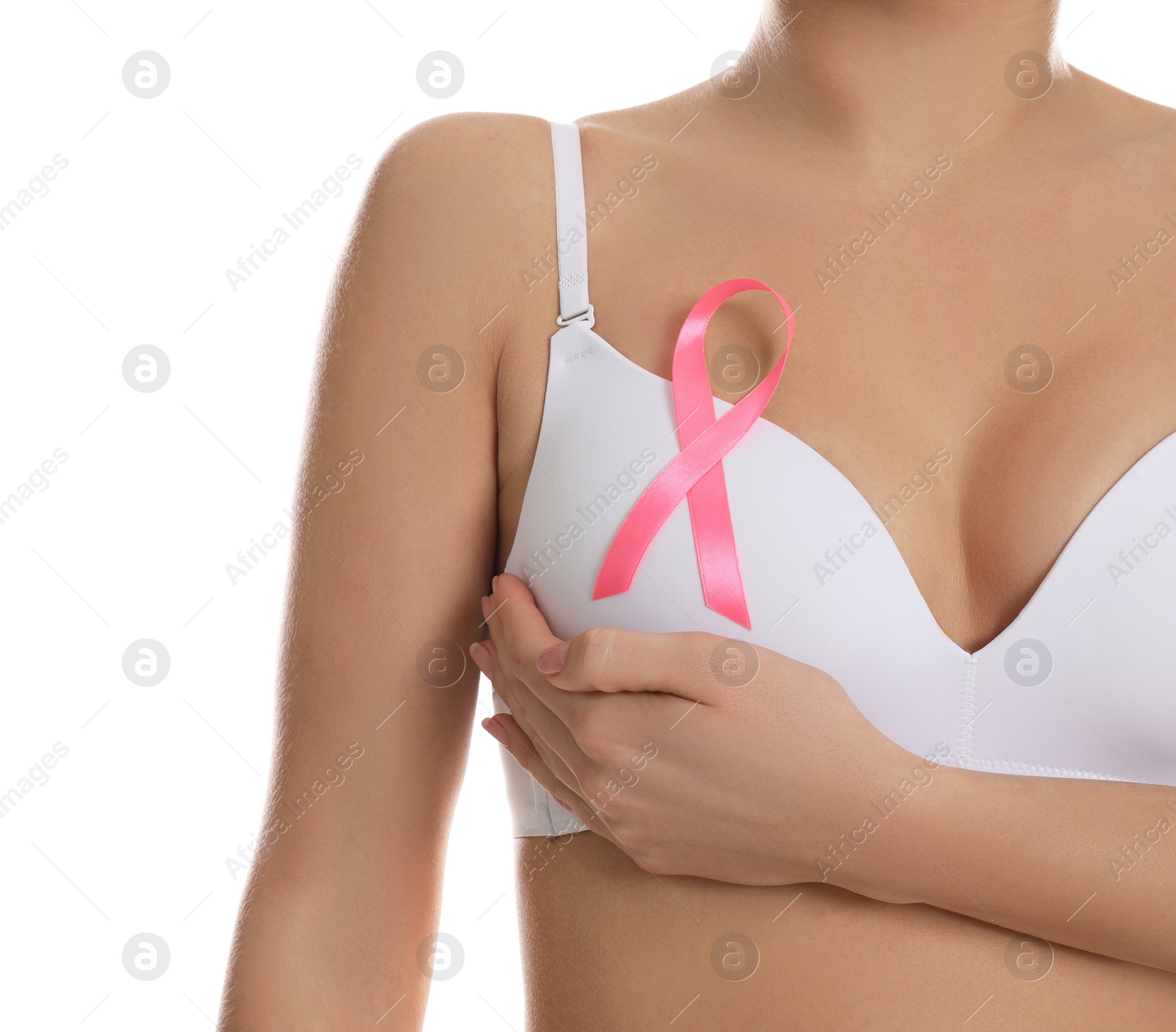 Photo of Woman with pink ribbon on white background, closeup. Breast cancer awareness