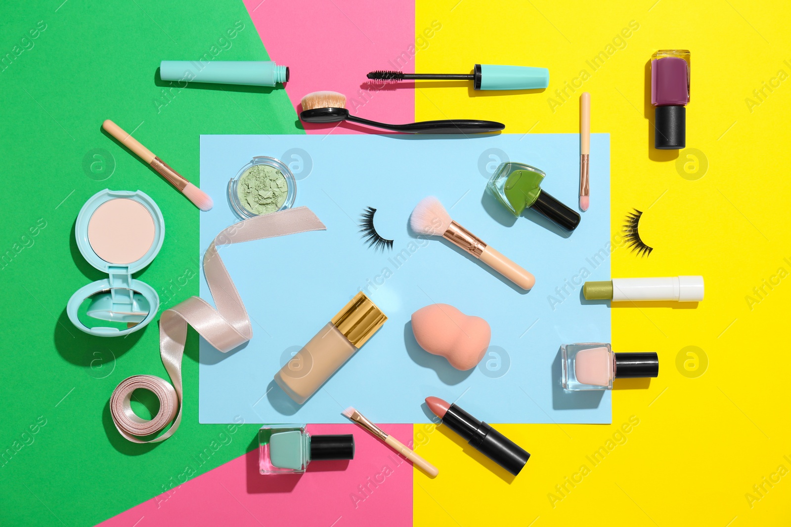 Photo of Flat lay composition with cosmetic products on color background