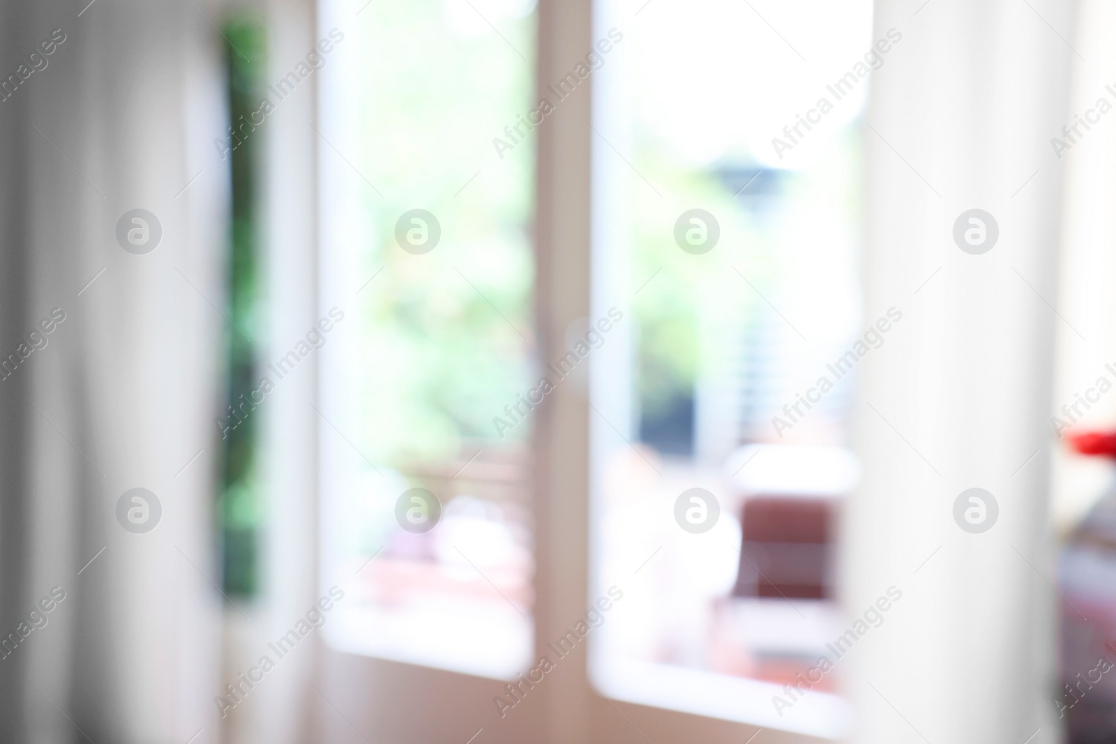 Photo of Blurred view of glass door at home