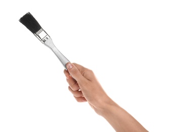 Woman holding paint brush on white background, closeup