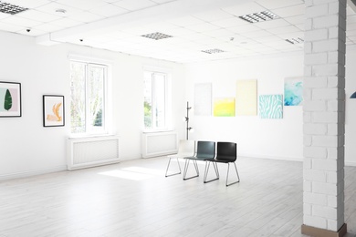 Photo of Chairs at empty exhibition in art gallery